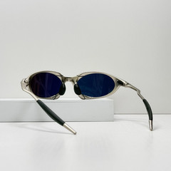 Oakley Romeo X-Metal sunglasses, silver frame. Golden lenses.
