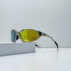 Oakley Romeo X-Metal sunglasses, silver frame. Golden lenses.