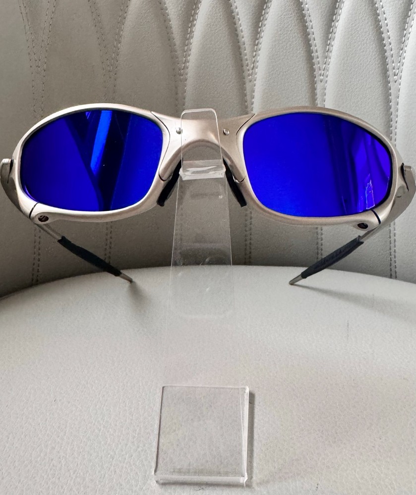 Oakley Juliet 1.0 X sunglasses, silver metal frame. Dark blue lenses