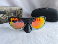 Oakley PLANTARIS Sunglasses OO9437-0136 Black Frame Polarized Red Lenses