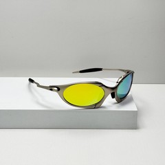 Oakley Romeo X-Metal sunglasses, silver frame. Golden lenses.