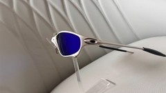 Oakley Juliet 1.0 X sunglasses, silver metal frame. Dark blue lenses