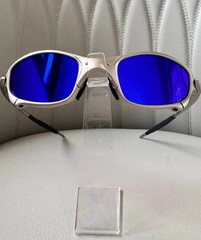 Oakley Juliet 1.0 X sunglasses, silver metal frame. Dark blue lenses