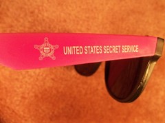 TWO PAIR ADULT UNITED STATES SECRET SERVICE NAME MARKED & USSS LOGOED SUNGLASSES