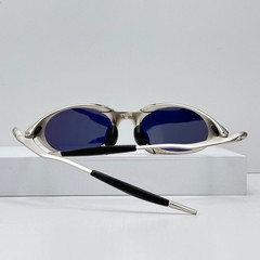 Oakley Romeo X-Metal sunglasses, silver frame. Golden lenses.