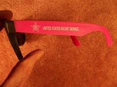 TWO PAIR ADULT UNITED STATES SECRET SERVICE NAME MARKED & USSS LOGOED SUNGLASSES