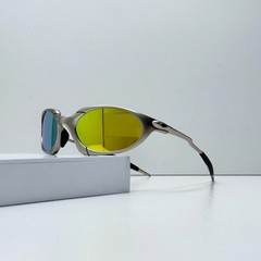 Oakley Romeo X-Metal sunglasses, silver frame. Golden lenses.