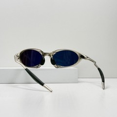 Oakley Romeo X-Metal sunglasses, silver frame. Golden lenses.