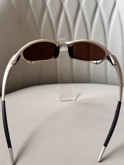 Oakley Juliet 1.0 X sunglasses, silver metal frame. Brown-tinted lenses