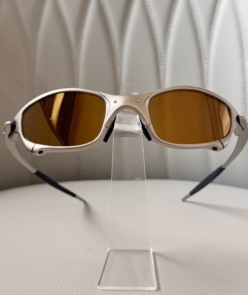 Oakley Juliet 1.0 X sunglasses, silver metal frame. Brown-tinted lenses