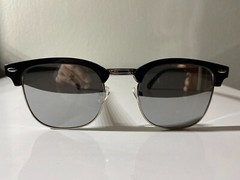 Classic 60’s style men’s sunglasses with black frame and reflective gray lenses