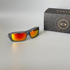 Oakley Gascan OO9014 Polarized Sunglasses Gray transparent frame with red lenses