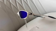 Oakley Juliet 1.0 X sunglasses, silver metal frame. Dark blue lenses